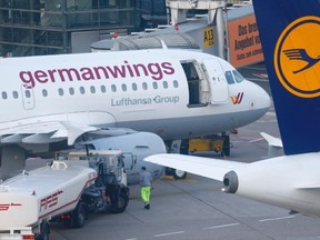 A Germanwings and Lufthansa aircraft are parked on the apron at Dusseldorf airport March 24, 2015. An Airbus operated by Lufthansa's Germanwings budget airline crashed in a remote snowy area of the French Alps on Tuesday, killing all 150 on board, including 16 schoolchildren. REUTERS/Ina Fassbender