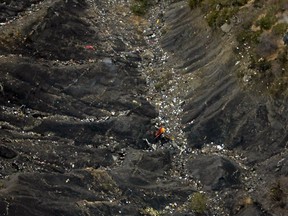 Debris from crashed Germanwings Airbus A320 are seen in the mountains, near Seyne-les-Alpes, March 24, 2015. French investigators on Wednesday searched for the reason why a German Airbus ploughed into an Alpine mountainside, killing all 150 on board including 16 teenagers returning from a school trip to Spain. Picture taken March 24, 2015. (REUTERS)