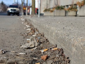 Cigarette butts and debris on Division St.