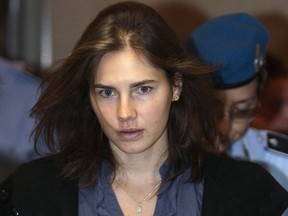 Amanda Knox, the U.S. student convicted of murdering her British flatmate Meredith Kercher in Italy in November 2007, arrives at the court during her appeal trial session in Perugia in this September 30, 2011 file photo. Italy's highest court was expected to rule on March 25, 2015 on whether to uphold the conviction of Knox and her former Italian boyfriend for the 2007 killing of British student Meredith Kercher. REUTERS/Alessandro Bianchi/Files
