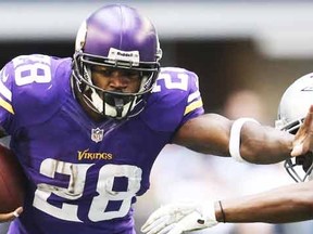 Minnesota Vikings Adrian Peterson runs with ball against the Dallas Cowboys in the first quarter at AT&T Stadium in Arlington, Texas in this file photo taken November 3, 2013. (REUTERS)