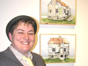 Dresden-area artist Pauline Moss stands beside her work, “Abandoned Icelandic House,” at the Thames Art Gallery. She is of more than 30 artists who are being featured in the Breaking Barriers exhibit that runs until May 10.