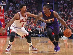 Phoenix Suns guard Eric Bledsoe (2) is defended by Chicago Bulls guard Derrick Rose (1) during the second quarter at the United Center. (Dennis Wierzbicki-USA TODAY Sports)