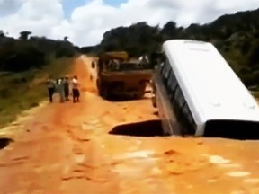 A passenger bus in Brazil fell into a sinkhole and was swept into a nearby river. (YouTube)