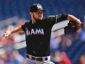 Miami Marlins starting pitcher Jarred Cosart (23) pitches during the first inning Washington Nationals in game one of a baseball doubleheader at Nationals Park. (Tommy Gilligan-USA TODAY Sports)