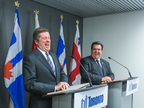Toronto Mayor John Tory (left) and visiting Montreal Mayor Denis Coderre address the media at City Hall in Toronto Wednesday March 25, 2015. (Ernest Doroszuk/Toronto Sun)