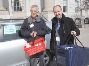Meals on Wheels volunteer driver Gerry Johnsrude, left, was joined by Mayor Bryan Paterson on his usual Wednesday route delivering hot meals to clients. It was part of an initiative to bring awareness to the issue of senior hunger and isolation. WED., MAR 25, 2015 KINGSTON, ONT. MICHAEL LEA THE WHIG STANDARD QMI AGENCY.