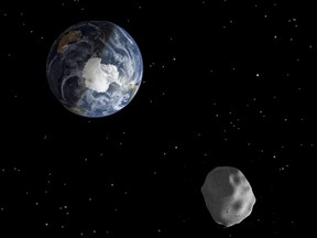 The passage of an asteroid through the Earth-moon system is depicted in this handout image from NASA. (REUTERS/NASA/JPL-Caltech/Handout)