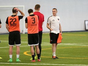 Ottawa Fury assistant coach Martin Nash, brother of Canadian basketball star Steve Nash, talks to players during soccer practice in Gatineau, Que. on Wednesday. (Chris Hofley/Ottawa Sun)