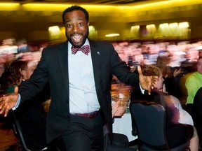 Victor Harris, the new business manager for Digital Echidna, celebrates on the way to the podium of the 32nd annual Business Achievement Awards after winning the Corporate Social Responsiblity Award in London. (Mike Hensen, The London Free Press)