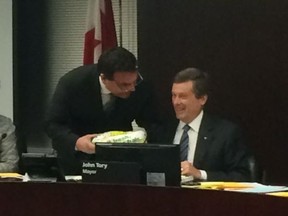 Councillor Giorgio Mammoliti presents Mayor John Tory with a Subway sandwich on Wednesday March 25, 2015 as a protest against the Finch LRT. (Don Peat/Toronto Sun)