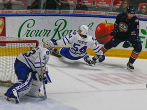 Forward Byron Froese goes hard into the boards during the Marlies’ 3-2 victory over the Oklahoma City Barons Wednesday morning at Ricoh Coliseum. (Dave Thomas/Toronto Sun)