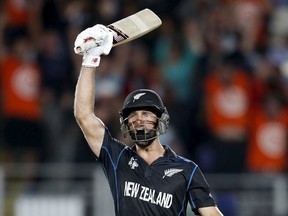 New Zealand's Grant Elliott reacts after hitting a shot for six runs to win aCricket World Cup semi-final match against South Africa. (Reuters)