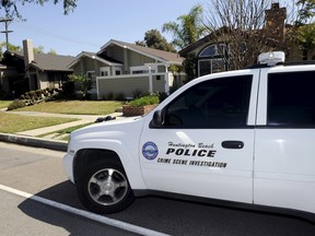 A Huntington Beach police Crime Scene Investigator vehicle is seen at the family home of Denise Huskins in Huntington Beach, Calif., on March 25, 2015. (REUTERS/Bob Riha Jr.)