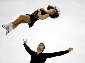 Meagan Duhamel and Eric Radford of Canada compete in the pairs free skating program during the ISU World Figure Skating Championship in Shanghai March 26, 2015. REUTERS/Carlos Barria