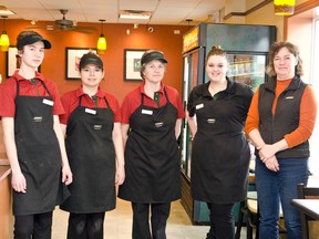 Linda Zacerucha poses with some of her staff at the newly renovated Subway.