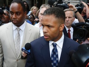 Jesse Jackson Jr. leaves his sentencing hearing in Washington, August 14, 2013.    REUTERS/Jason Reed