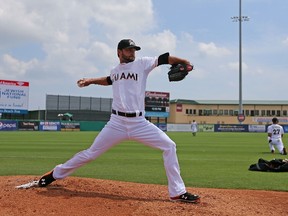 Jarred Cosart of the Miami Marlins warms up before the game against the Minnesota Twins at Roger Dean Stadium on March 22, 2015 in Jupiter, Florida. (Rob Foldy/Getty Images/AFP)