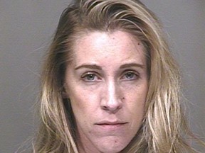 Lindsey Radomski is pictured in this undated booking photo provided by the Scottsdale Police Department. Romanski, a yoga instructor in Arizona, was arrested after she allegedly allowed seven teenage boys to fondle her newly enhanced breasts and performed oral sex on one of them while attending a Bar Mitzvah last weekend, police said on March 25, 2015. REUTERS/Scottsdale Police Department/Handout