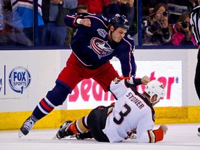 Jared Boll of the Columbus Blue Jackets throws a punch against Clayton Stoner of the Anaheim Ducks during the second period on March 24, 2015 at Nationwide Arena. (Kirk Irwin/Getty Images/AFP)