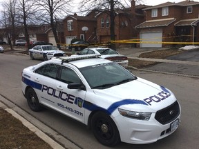 Peel Regional Police at at the scene of a double stabbing on McGraw Ave. in Brampton Thursday, March 26, 2015. (CHRIS DOUCETTE/TORONTO SUN)