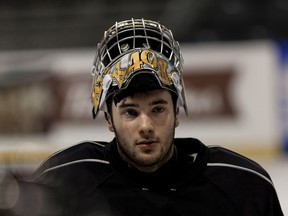 Kingston Frontenacs goalie Lucas Peressini takes a break during a practice on Wednesday. (Annie Sakkab/For The Whig-Standard)