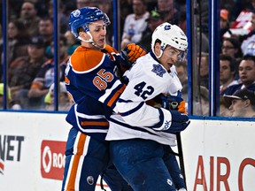 Martin Marincin, shown here tangling with Tyler Bozak when the Leafs were in town on March 16, is playing a grittier game, says head coach  Todd Nelson. (Codie McLachlan, Edmonton Sun)