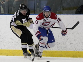 Kingston Voyageurs' Joey Beaudoin tries to get past Trenton Golden Hawks' Bobby Polachek during Ontario Junior Hockey League action at the Invista Centre on Jan. 15. The teams open the North-East Conference final in Trenton on Friday night. (Ian MacAlpine/The  Whig-Standard)