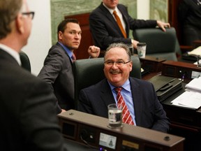 NDP MLA Brian Mason (right) shares a laugh with Rimbey-Rocky Mountain House-Sundre MLA Joe Anglin before Alberta finance minister Robin Campbell delivered Budget 2015 in the Alberta Legislature in Edmonton, Alta., on Thursday, March 26, 2015. Ian Kucerak/Edmonton Sun