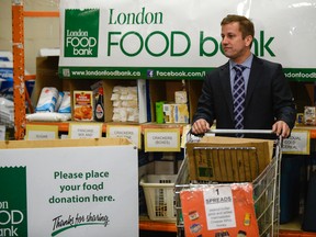 Western University Prof. Jason Gilliland speaks at Thursday?s spring food drive launch at the London Food Bank. London has third highest percentage of low income Ontarians behind Windsor and Toronto. (ANDREW LAHODYNSKYJ, The London Free Press)