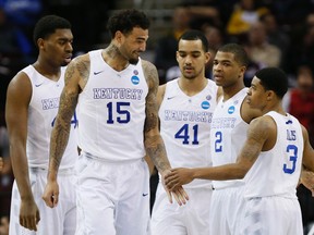 Kentucky Wildcats players celebrate during their game against West Virginia on Thursday. (USA TODAY SPORTS)