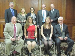 The Chatham-Kent Chamber of Commerce held its 127th annual Business Excellence Awards banquet at Club Lentinas in Chatham on Thursday, March 26, 2015. Front row, from left: Don 'Sparky' Leonard accepted the Corporate Citizen of the Year Award on behalf of Victory Ford Lincoln Sales Ltd.; Emily Meko, owner of Eat What's Good, was named both Entrepreneur of the Year and Business Professional of the Year; Jessica Weaver was named Youth Entrepreneur of the Year; and Barry Fraser was named Citizen of the Year. Back row: Bob and Diane Devolder and their daughter, Lisa, of Devolder Farms, which was named Industry of the Year; Brad Goldsmith and Kevin Deacon of Southwest Granite & Glass, which was named the Business of Excellence. 
DON ROBINET/QMI AGENCY