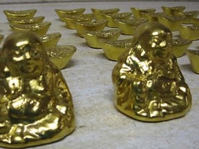 Mounties in Richmond, B.C., are warning about a scheme led by a man who claims to be a foreign construction worker who came across a stash of gold bars and Buddhas and is willing to sell them for cheap. (!MI Agency/Richmond RCMP)