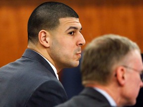 Former New England Patriots football player Aaron Hernandez (L), sits with his defense attorney Charles Rankin  during his murder trial in Fall River, Massachusetts March 26, 2015. Hernandez is charged with killing semi-professional football player Odin Lloyd. REUTERS/Steven Senne/Pool