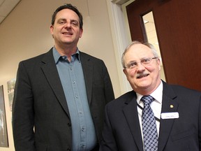 March of Dimes Canada's Dennis Ullman is pictured with the Business Enterprise Centre's Fraser Parry at Friday's Opening Doors for Accessibility event in Sarnia. The awareness event at the Bayside centre focused on the stories of people with disabilities, as well as available services and support. (TYLER KULA/ THE OBSERVER/ QMI AGENCY)