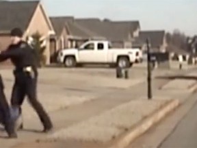 A police cruiser dash captured an Alabama police officer throwing an Indian man to the ground. (YouTube screengrab)