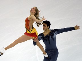 Kaitlyn Weaver (L) and Andrew Poje of Canada compete in the ice dance free dance during the 2015 ISU World Figure Skating Championships at the Shanghai Oriental Sports Center in Shanghai on March 27, 2015.    AFP PHOTO / GOH CHAI HIN
