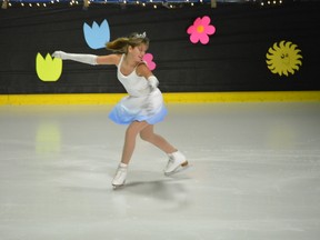 Cassandra Olson performs to the song Let it Go from the Frozen soundtrack as part of the Tri Area Skating Club's year-end recital. - April Hudson, Reporter/Examiner