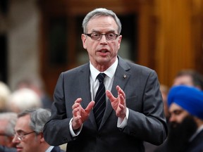 Finance Minister Joe Oliver stands to speak during Question Period in the House of Commons on Parliament Hill in Ottawa March 10, 2015. REUTERS/Chris Wattie