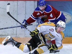 Brandon Wheat kings' Jayce Hawryluk and Edmonton Oil Kings' Blake Orban scramble for the puck during Game 1 of eastern conference quarter-finals, Thursday evening at Westman Place. Colin Corneau/Brandon Sun