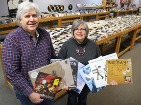 Roland and Mary Anne Peloza, of Cheeky Monkey, show off some vinyl records released exclusively on previous Record Store Days on Friday March 27, 2015 in Sarnia, Ont. The owners of Sarnia's only remaining music store are gearing up for this year's Record Store Day set for April 18. (Barbara Simpson, The Observer)