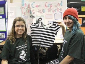 Max Silburn and Jesenia Alvarez, from Sydenham Public School, hold up the crop top they both wore to school to gauge the other students' reactions for their project on gender bias for the regional science fair, held Friday at McArthur Hall on the Queen's University west campus. FRI., MAR 27, 2015 KINGSTON, ONT. MICHAEL LEA THE WHIG STANDARD QMI AGENCY