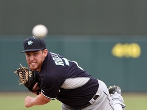 David Rollins of the Seattle Mariners pitches against the Oakland Athletics at HoHoKam Stadium on March 12, 2015 in Mesa, Arizona.  Lisa Blumenfeld/AFP