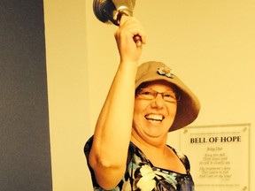 Judy Bennett ringing the Bell of Hope in September 2014 after her last treatment at the Cross Cancer Institute in Edmonton. - Photo Supplied