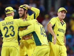 Australia’s Glenn Maxwell (second from left) celebrates with teammates during their semifinal win over India. (REUTERS)