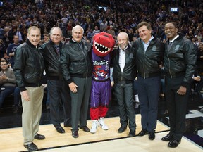 The original Raptors executives, including John Bitove Jr. (second from right) and Isiah Thomas (right), were honoured at the Air Canada Centre last night.