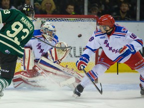 London Knights forward Mitchell Marner shoots the puck past Kitchener goalie Jake Paterson for the first of his two first-period goals in Game 1 of their best-of-seven Ontario Hockey League Western Conference quarterfinal series at Budweiser Gardens on Friday night. The Knights won 3-1. (MIKE HENSEN, The London Free Press)