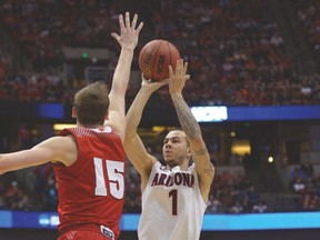Arizona Wildcats’ Gabe York takes a shot during last year’s Elite Eight matchup against Wisconsin. (USA TODAY SPORTS)