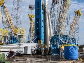 A Soyuz rocket is moved from its assembly building to its launch pad at the Guiana Space Centre in Kourou, French Guiana, on March 24, 2015. The Russian-built Soyuz rocket launched March 27, carrying two satellites to Europe's Galileo navigation system as part of the Full Operational Capability (FOC) program. (AFP PHOTO/JODY AMIET)