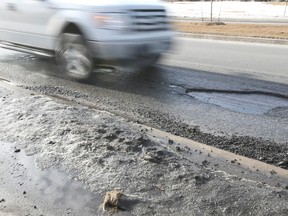 Potholes before they were repaired, along Danforth Ave, east of Birchmount  Rd, and the resulting images were filed on March 25, 2015. (Veronica Henri/Toronto Sun)